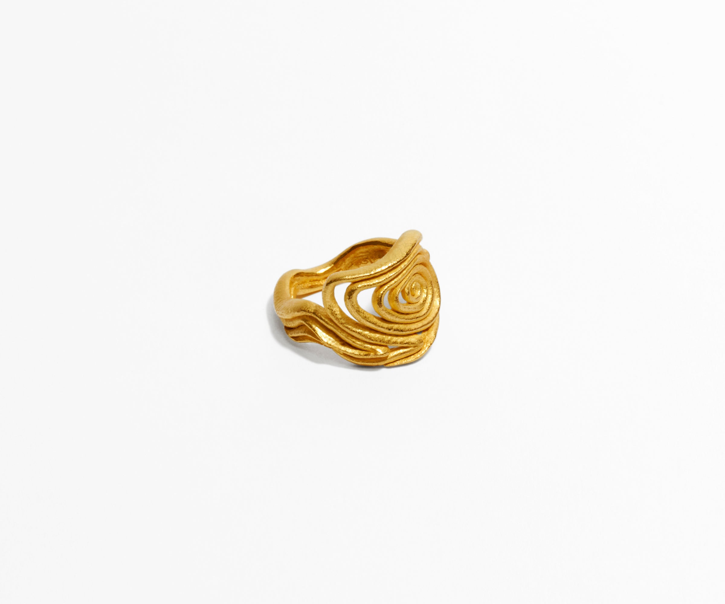 An 18K yellow gold ring shaped organically, inspired by nature. The center part resembles a spiral.